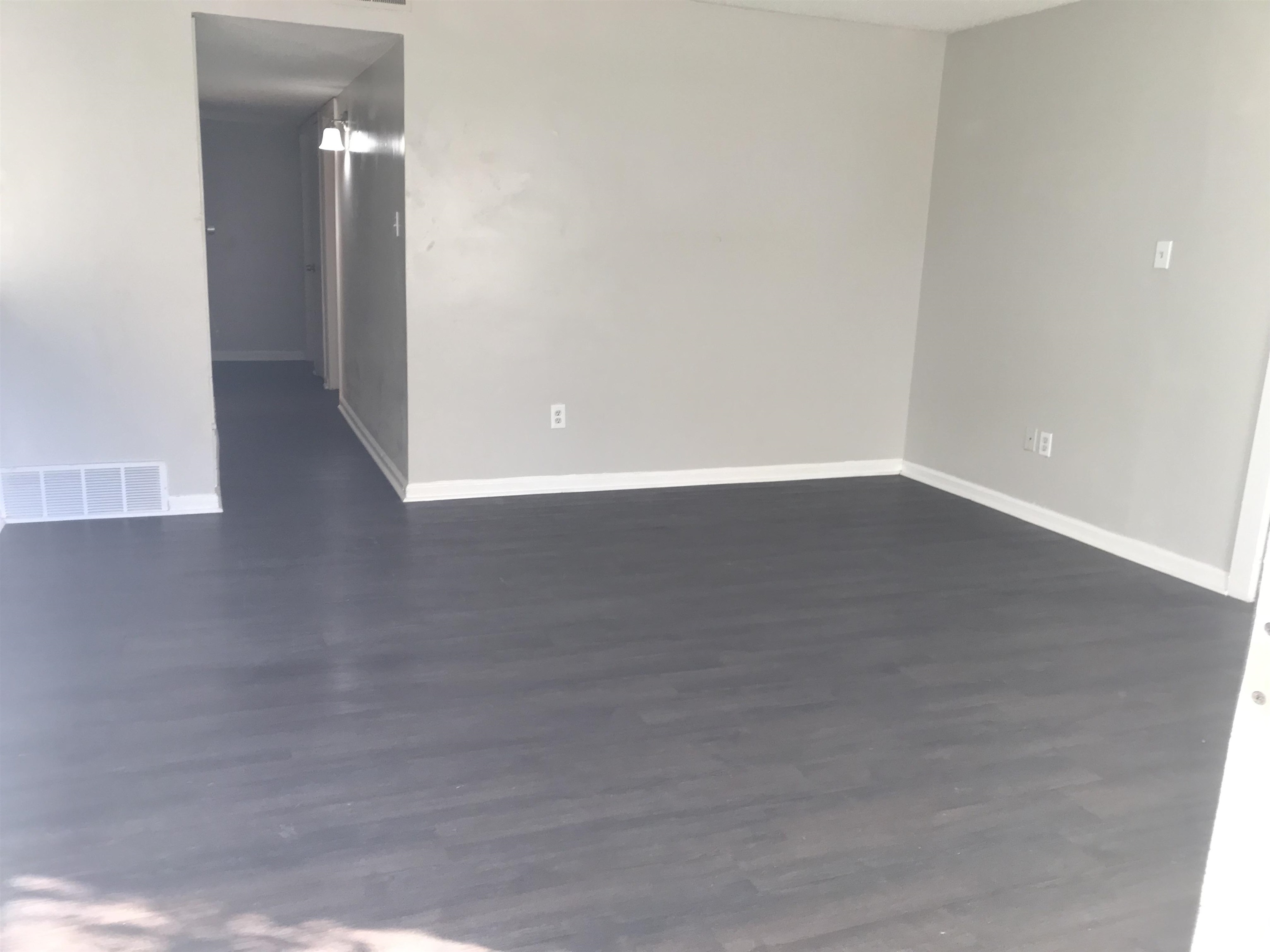 48 South Bristol Road Marion, AR 72364 - Photo 2 of 18 Spare room with dark wood-style flooring