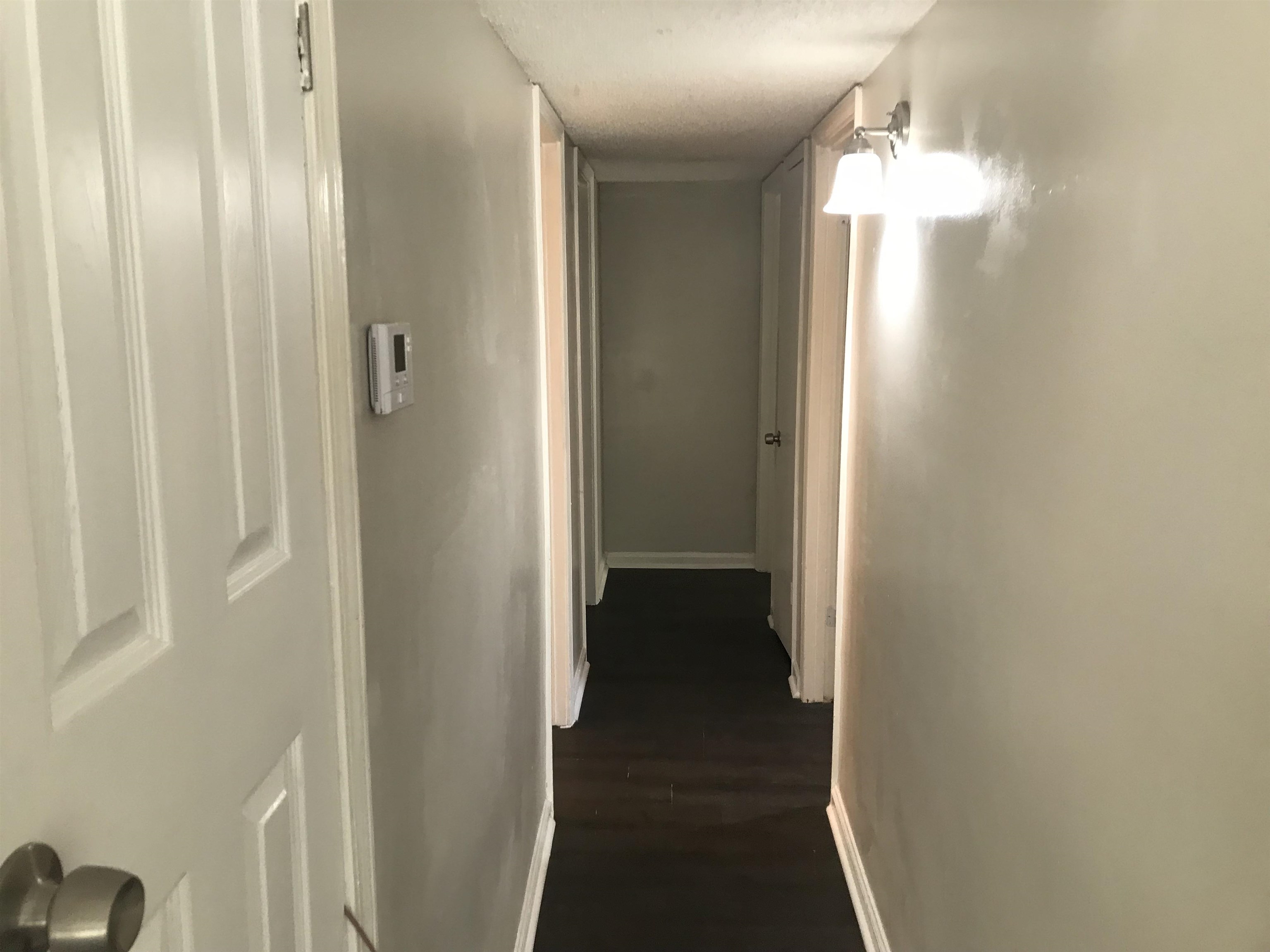 48 South Bristol Road Marion, AR 72364 - Photo 3 of 18 Hall with baseboards and dark wood-style floors
