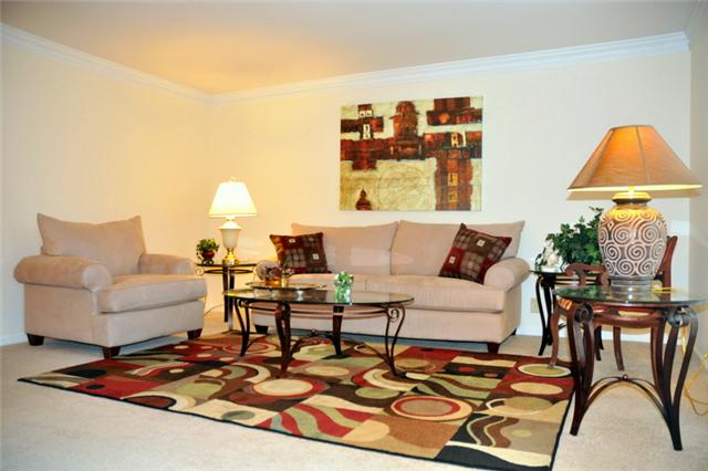 1301 General George Patton Road Nashville, TN 37221 - Photo 1 of 10 a living room with furniture and a table