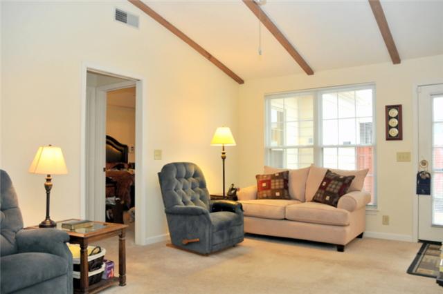 1301 General George Patton Road Nashville, TN 37221 - Photo 7 of 10 a living room with furniture and a window