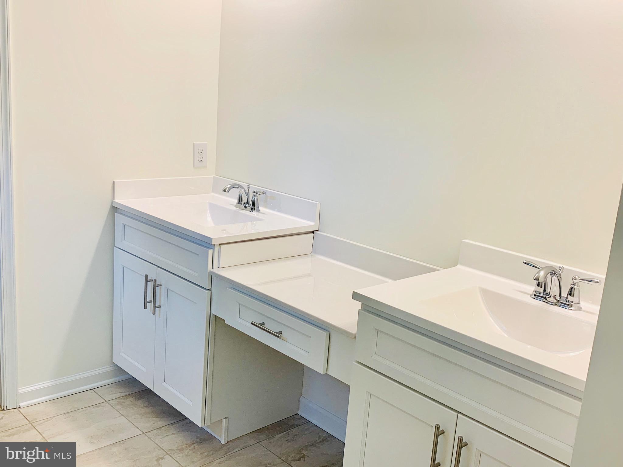 7 Patriots Way Georgetown, DE 19947 - Photo 15 of 29 a bathroom with a sink and a mirror