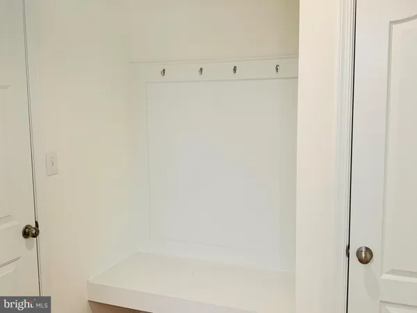 a kitchen with granite countertop a sink a stove and cabinets