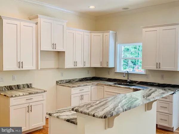 a view of a kitchen with marble wall and a fireplace