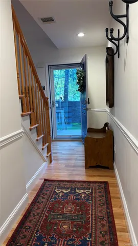 a room with lots of frames and rug