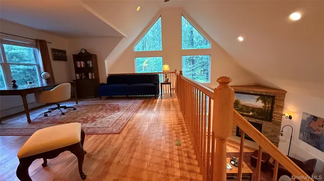 a living room with furniture fireplace and flat screen tv