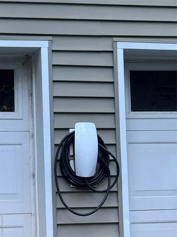 a view of staircase with wooden floor and cabinets