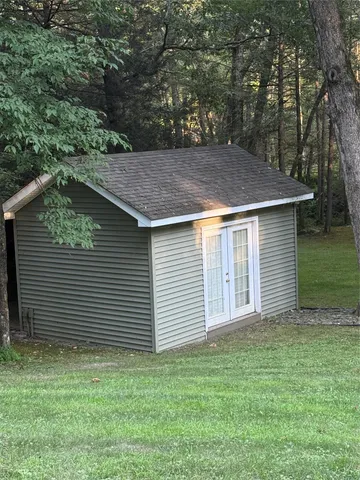 a backyard of a house with lots of green space