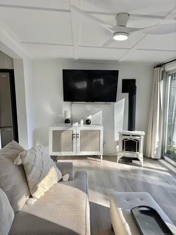 a front view of a house with swimming pool and sitting area