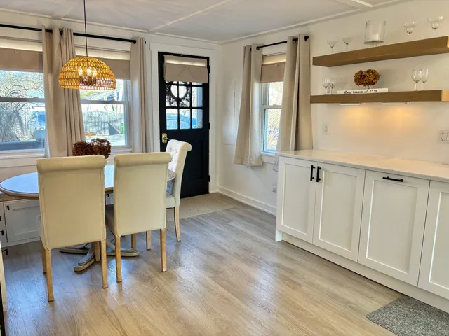 a view of a living room and a large window