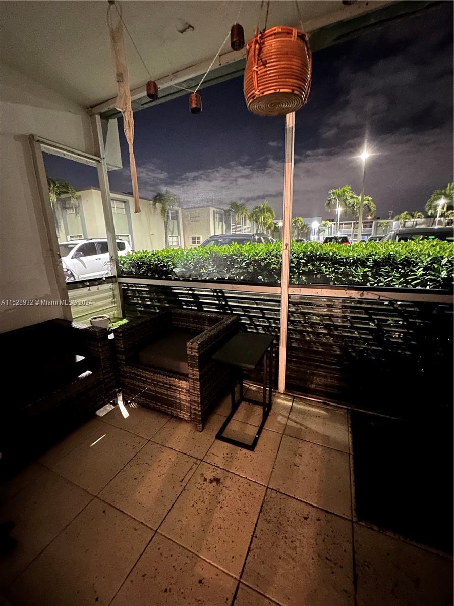 8794 Southwest 12th Street, Unit 108 Miami, FL 33174 - Photo 5 of 7 a room with lots of counter space and potted plants