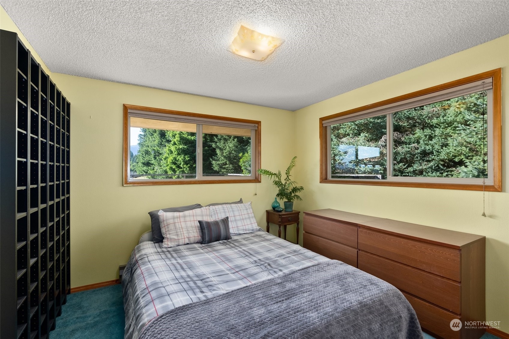 434 Cispus Road Randle, WA 98377 - Photo 18 of 40 a bedroom with a large bed and a window