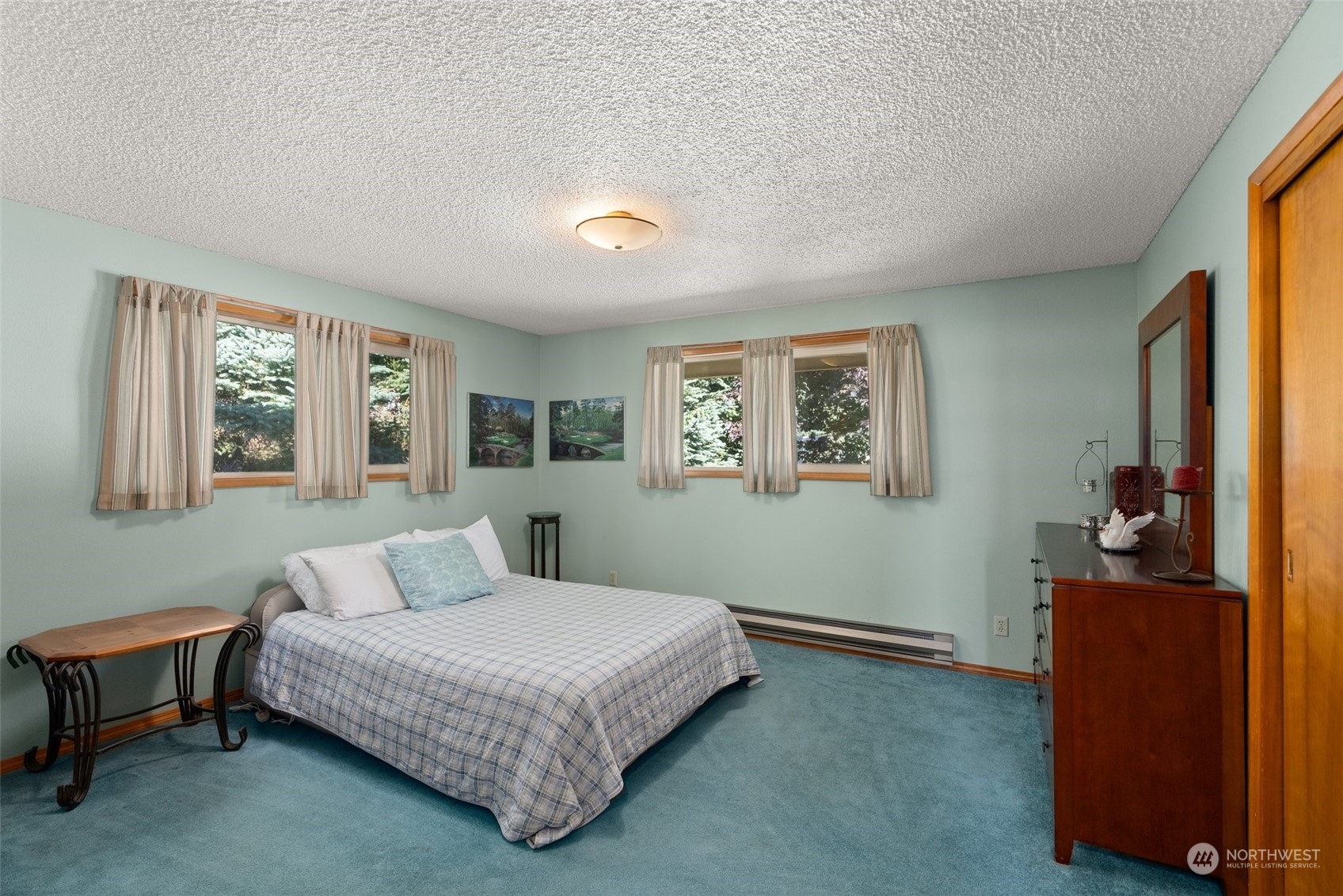434 Cispus Road Randle, WA 98377 - Photo 20 of 40 a bedroom with a large bed and a window