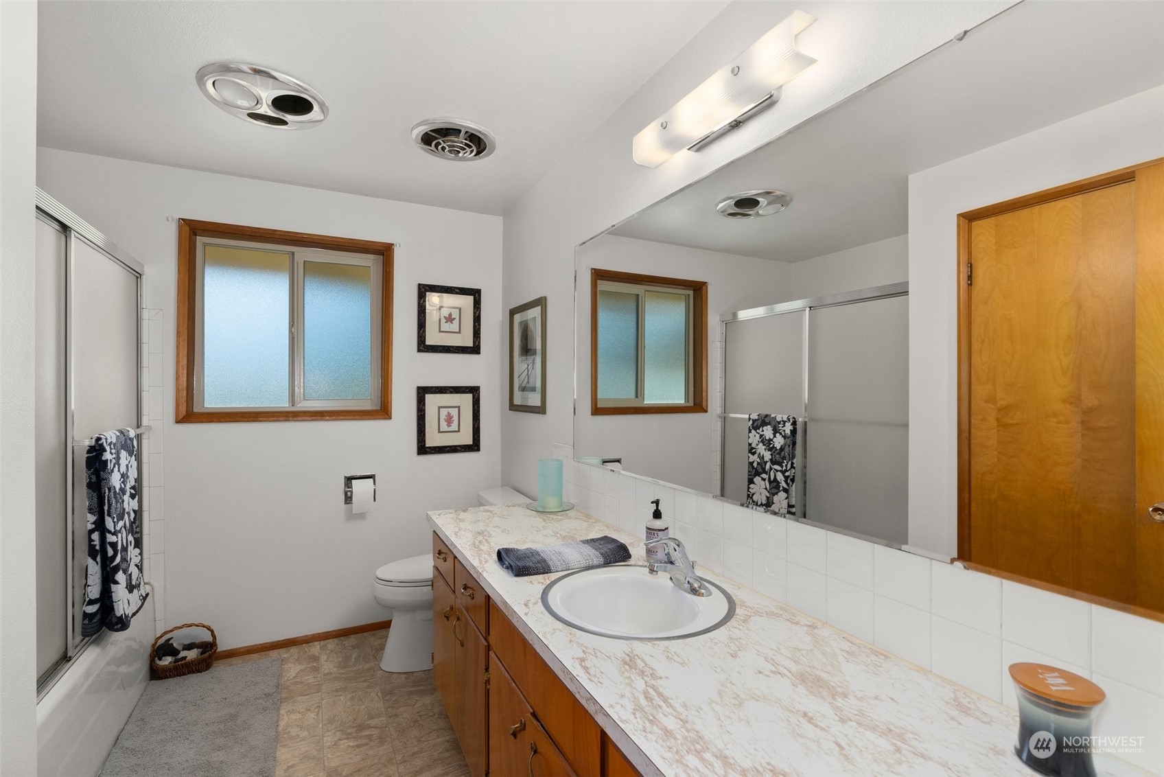 434 Cispus Road Randle, WA 98377 - Photo 21 of 40 a bathroom with a granite countertop sink mirror and vanity