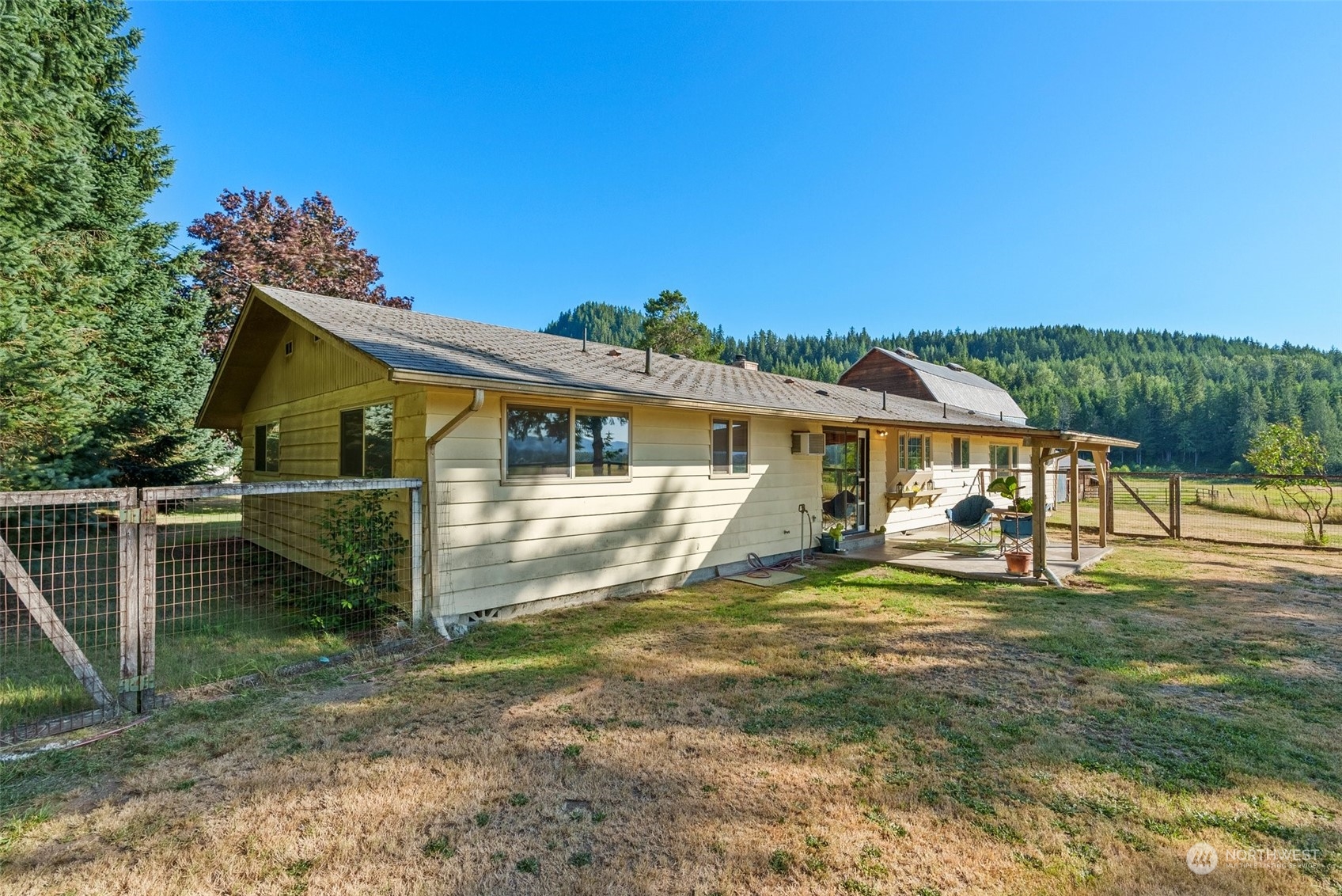 434 Cispus Road Randle, WA 98377 - Photo 24 of 40 a view of a house with a yard