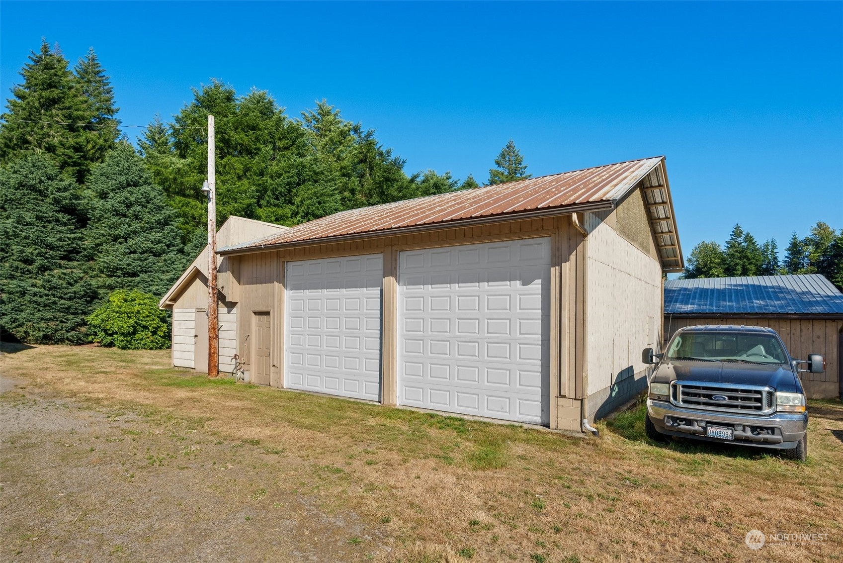 434 Cispus Road Randle, WA 98377 - Photo 25 of 40 a view of a house with a car parked in it