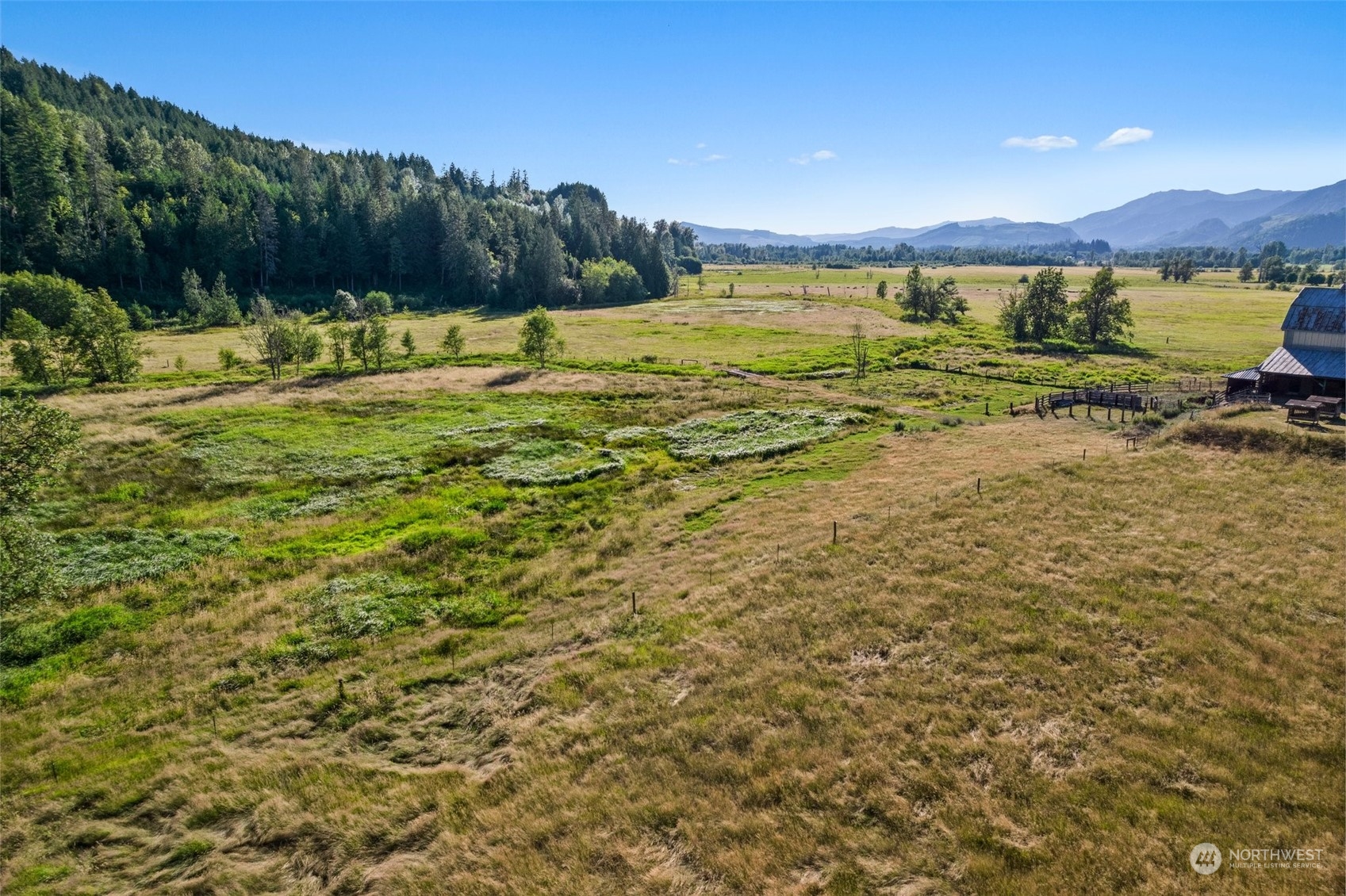 434 Cispus Road Randle, WA 98377 - Photo 33 of 40 a view of a lake with houses in the back