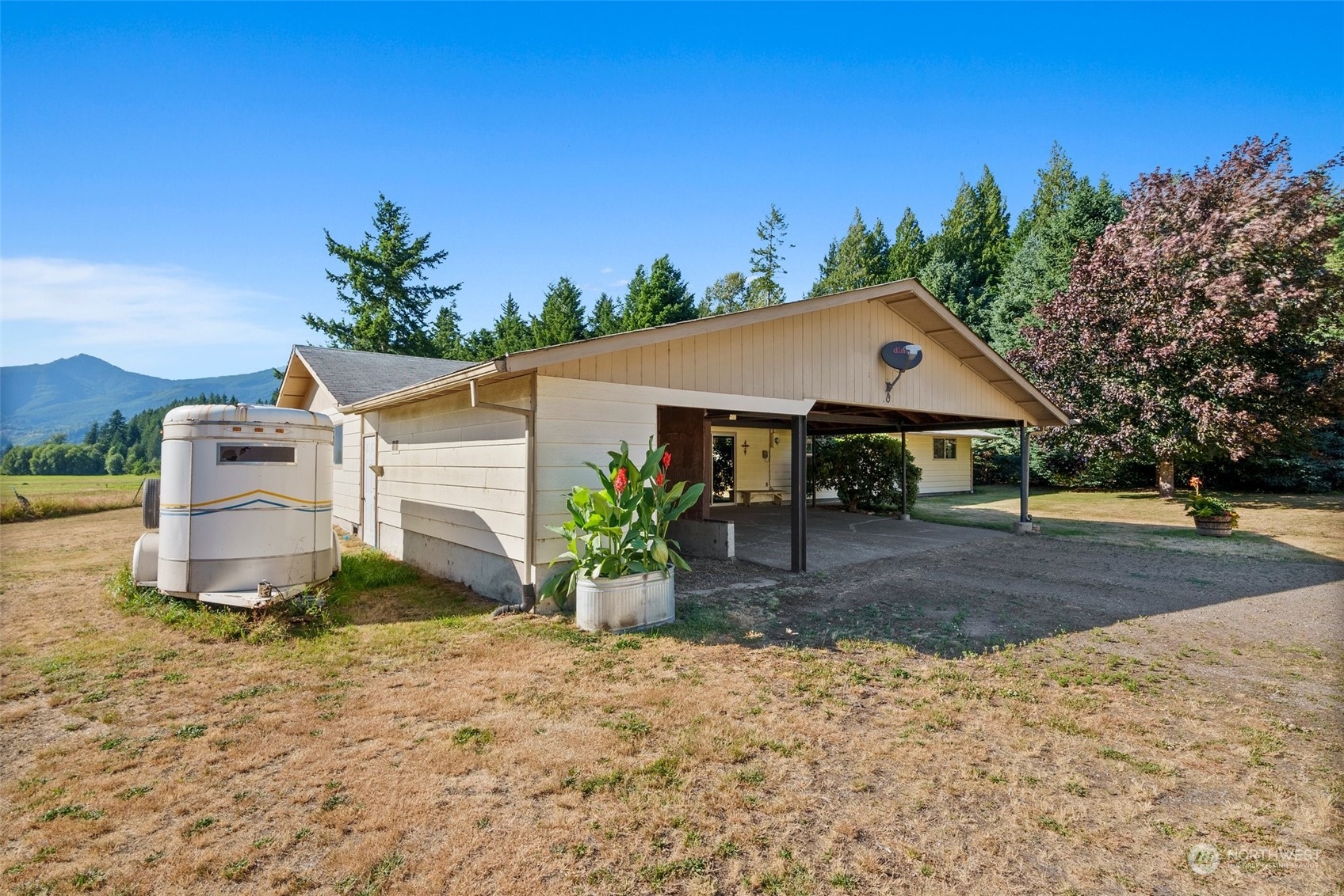 434 Cispus Road Randle, WA 98377 - Photo 4 of 40 a aerial view of a house with table and chairs in patio