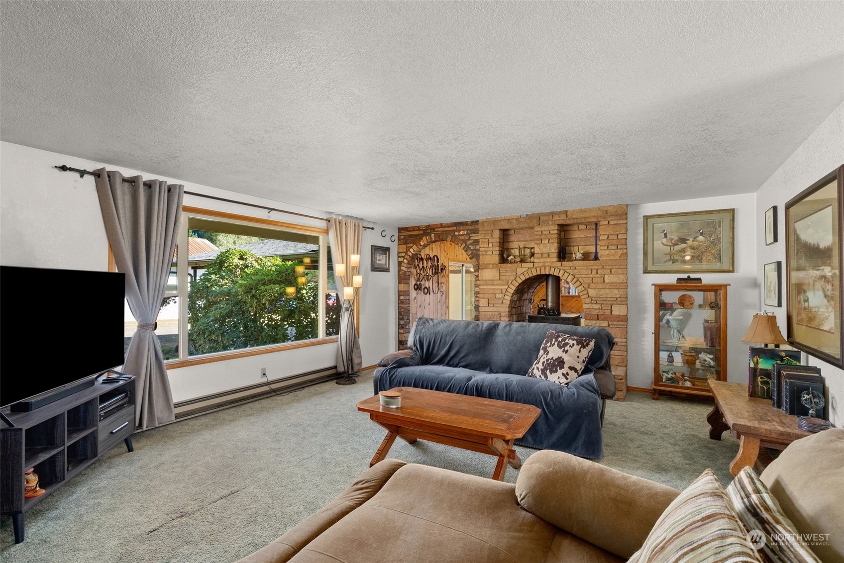 434 Cispus Road Randle, WA 98377 - Photo 5 of 40 a living room with furniture and a flat screen tv