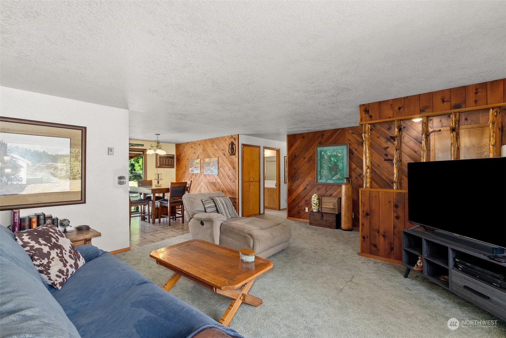434 Cispus Road Randle, WA 98377 - Photo 6 of 40 a living room with furniture and a flat screen tv
