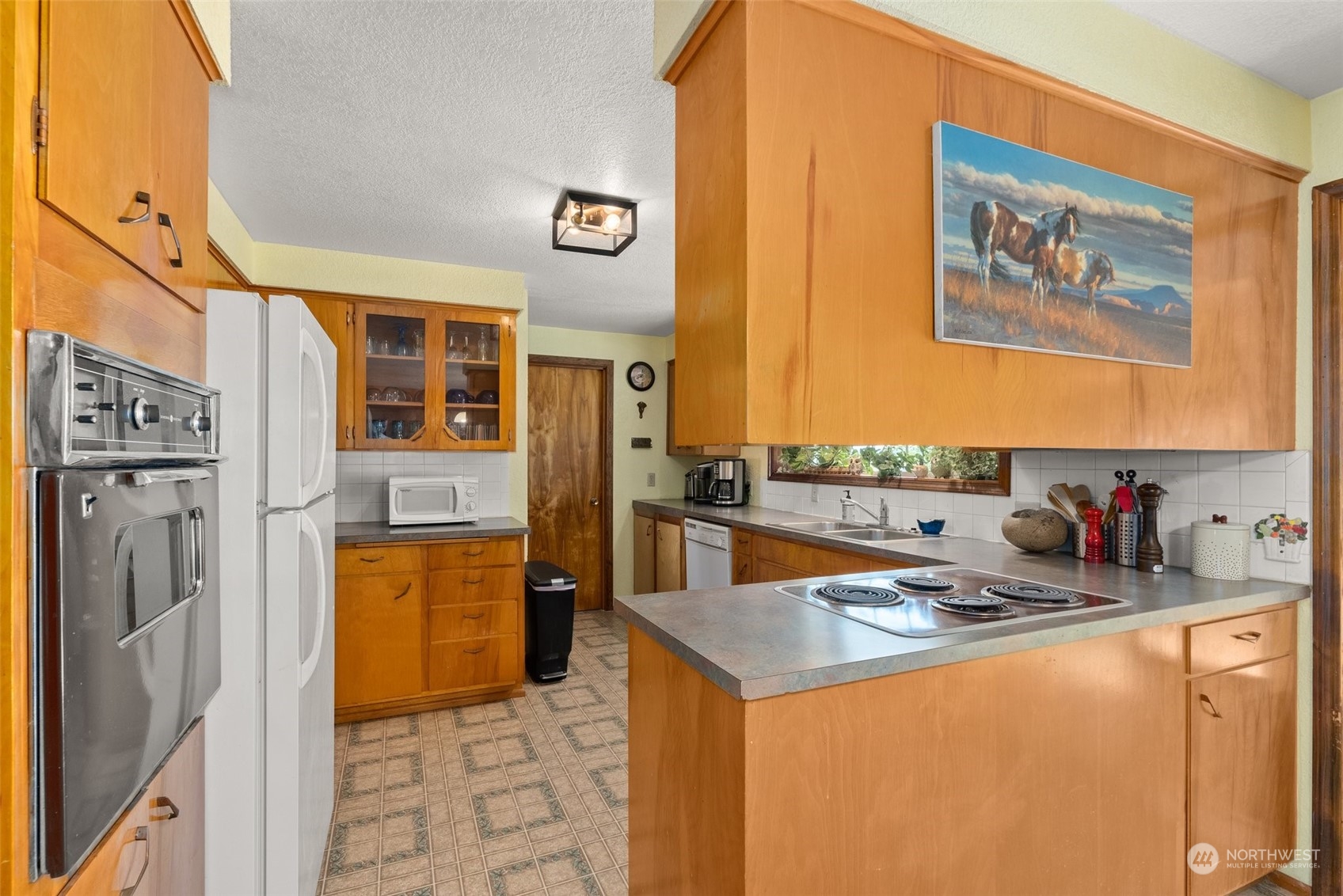 434 Cispus Road Randle, WA 98377 - Photo 8 of 40 a kitchen that has a sink and a refrigerator