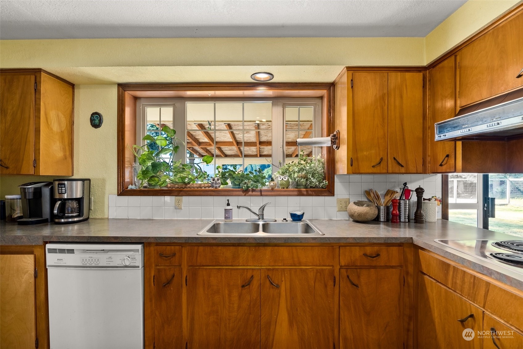 434 Cispus Road Randle, WA 98377 - Photo 9 of 40 a kitchen with stainless steel appliances a sink window and cabinets