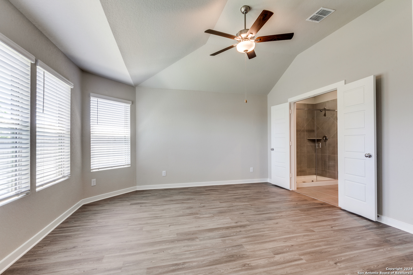 13602 Crossbow Ridge San Antonio, TX 78253 - Photo 6 of 12 wooden floor in an empty room with a window