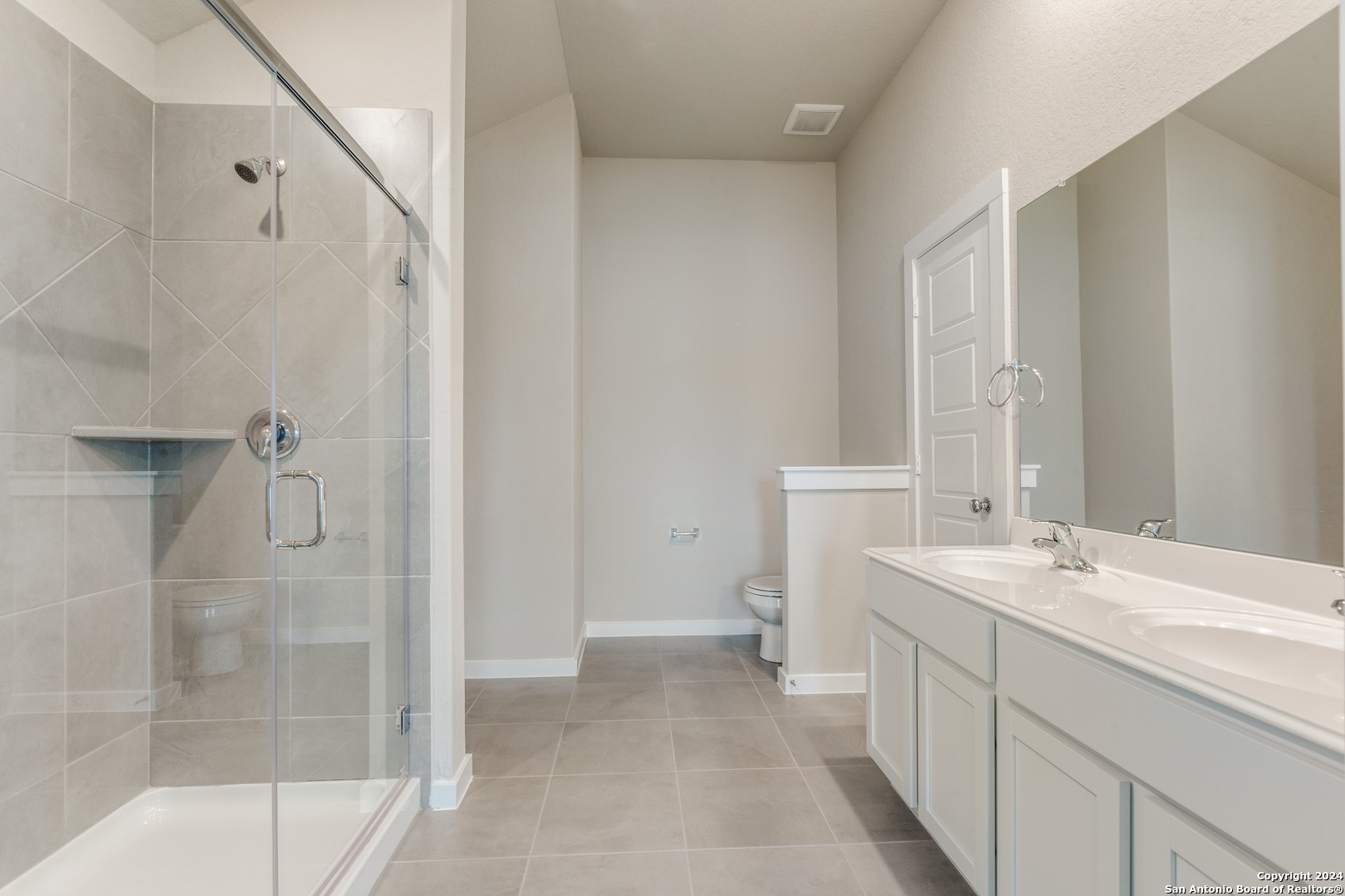 13602 Crossbow Ridge San Antonio, TX 78253 - Photo 7 of 12 a bathroom with a sink and mirror