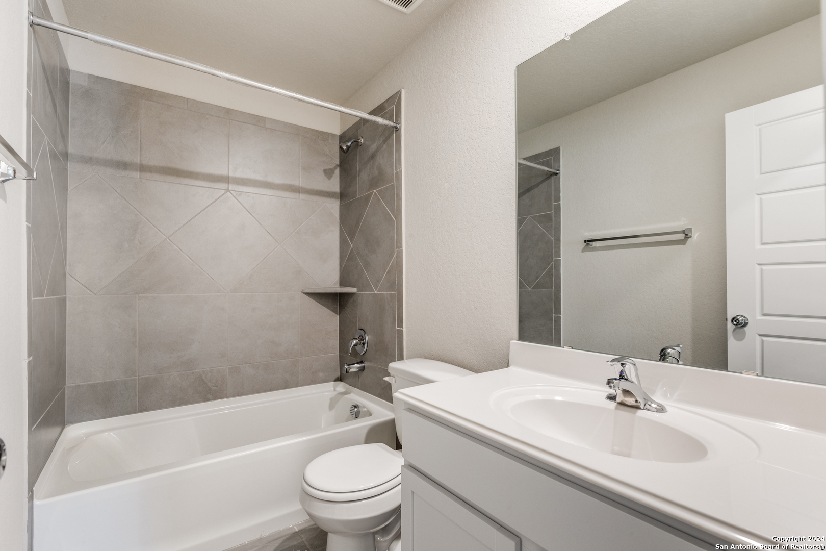 13602 Crossbow Ridge San Antonio, TX 78253 - Photo 10 of 12 a bathroom with a bathtub shower sink vanity and toilet