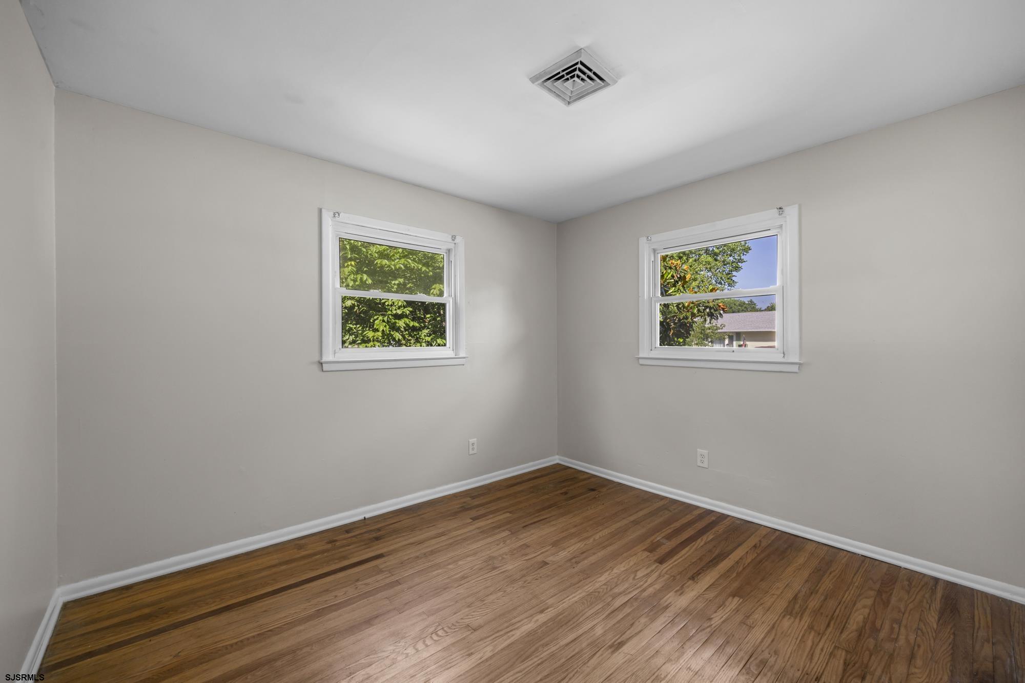 121 Osborne Road Somers Point, NJ 08244 - Photo 17 of 28 a view of room with window and wooden floor