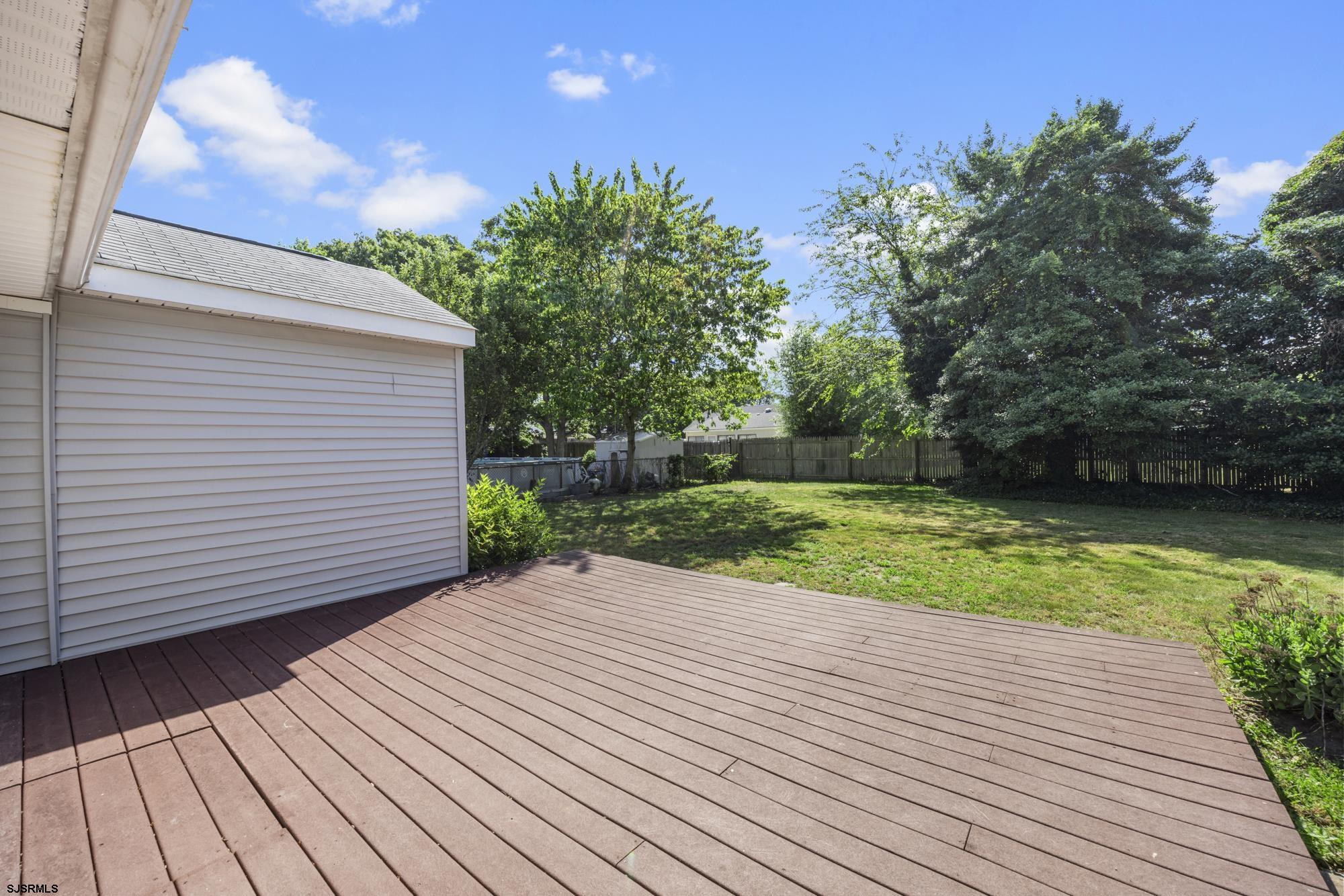 121 Osborne Road Somers Point, NJ 08244 - Photo 23 of 28 a view of a backyard with a wooden deck