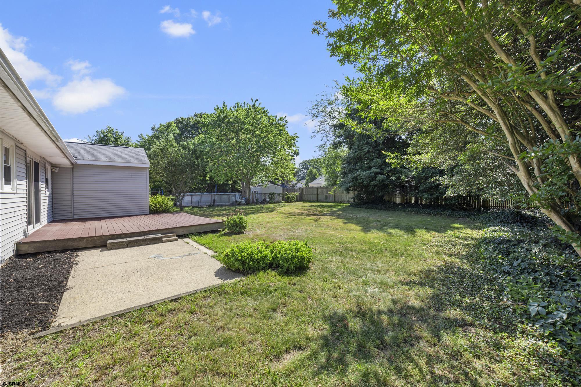 121 Osborne Road Somers Point, NJ 08244 - Photo 24 of 28 a view of a backyard with large trees