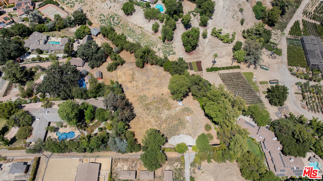 23621 Long Valley Road Hidden Hills, CA 91302 - Photo 9 of 26 an aerial view of a house with a yard