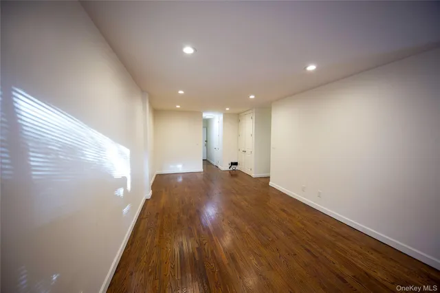 a view of hallway with wooden floor