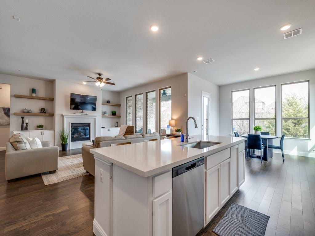 2112 Deer Run Court Gunter, TX 75058 - Photo 13 of 32 a large living room with fireplace furniture and a large window