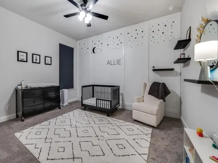 a living room with furniture and a lamp