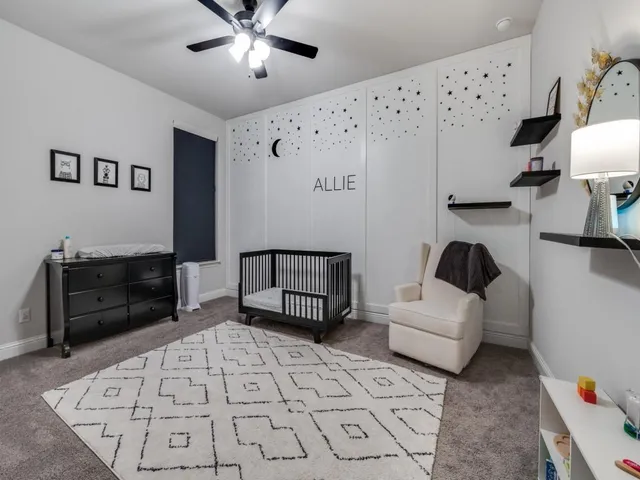 a living room with furniture and a lamp