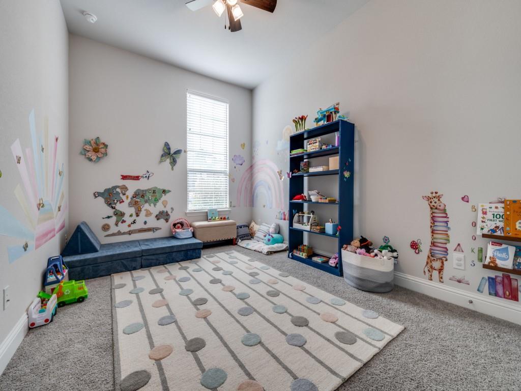 2112 Deer Run Court Gunter, TX 75058 - Photo 18 of 32 a bedroom with furniture and a book shelf