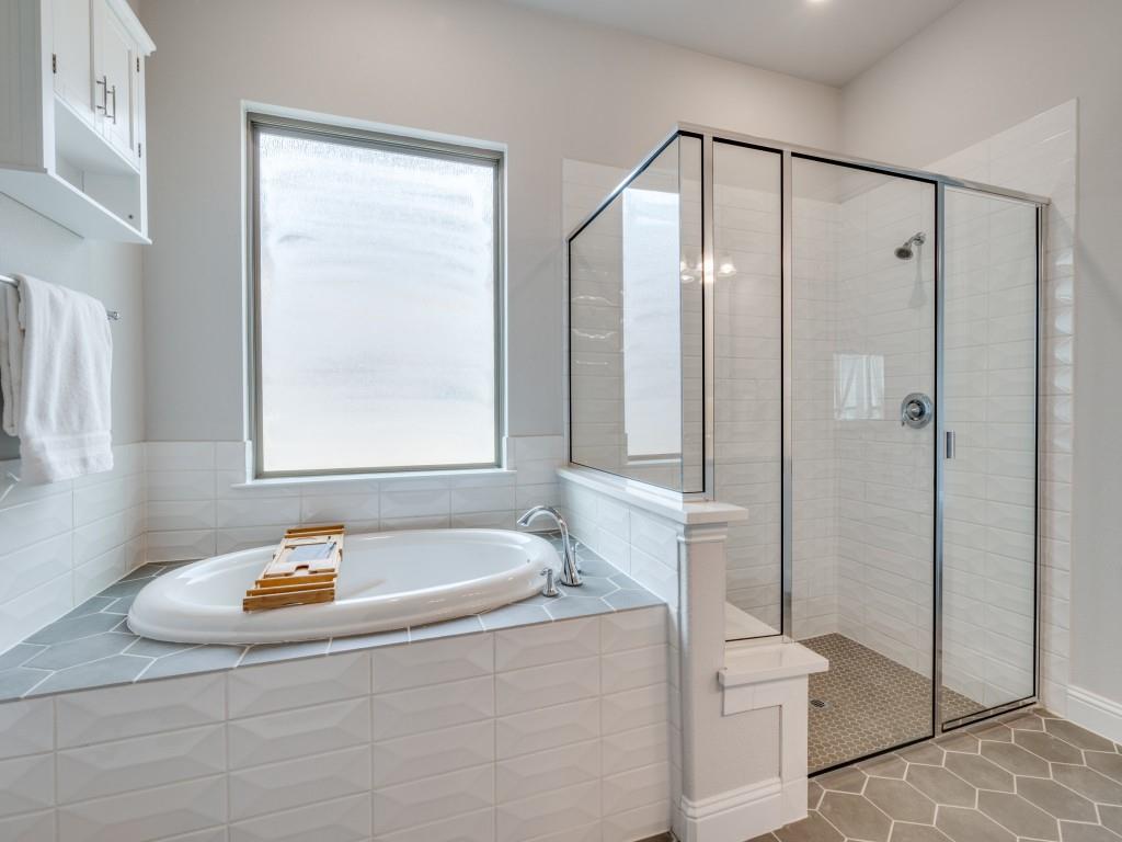 2112 Deer Run Court Gunter, TX 75058 - Photo 23 of 32 a bathroom with a tub a toilet and a shower