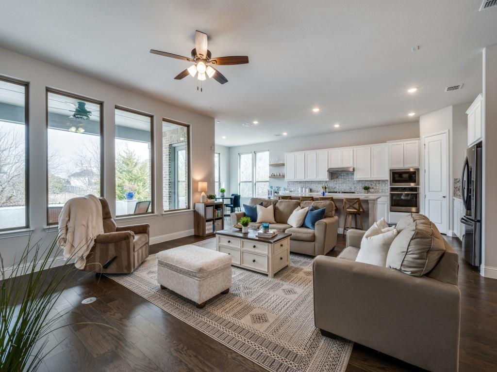 2112 Deer Run Court Gunter, TX 75058 - Photo 9 of 32 a living room with furniture kitchen area and a large window
