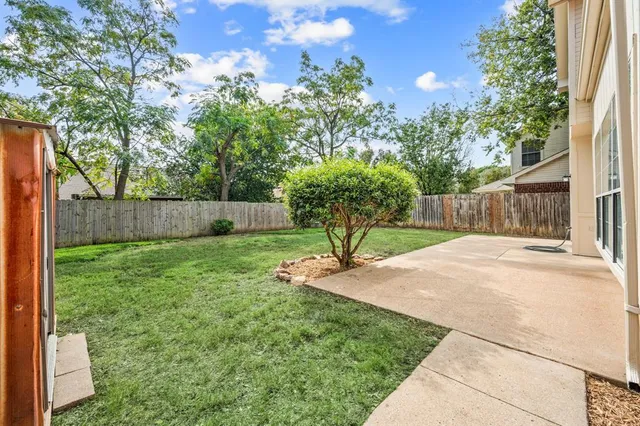 a backyard of a house with lots of green space