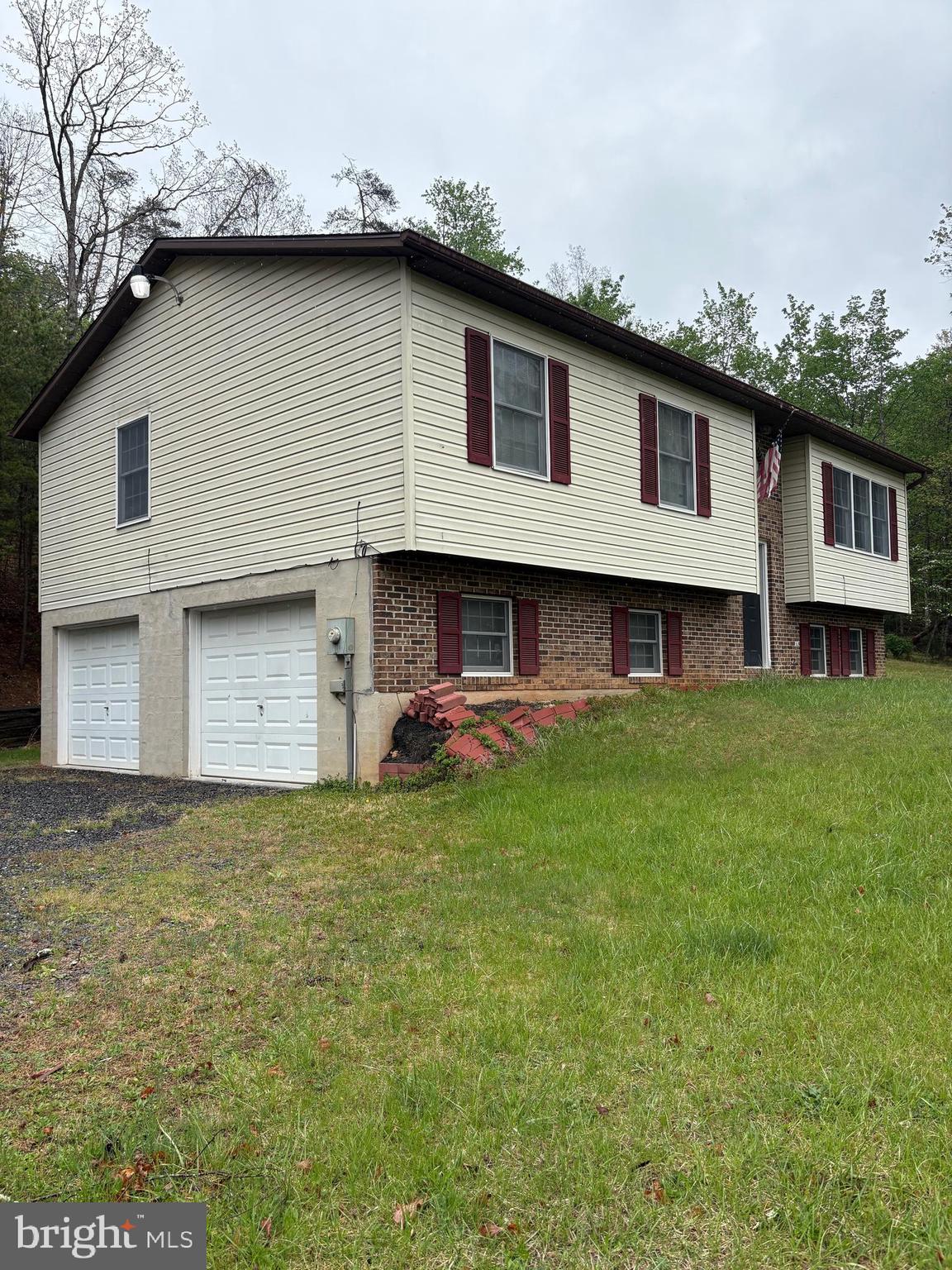 2865 Capon Springs Road High View, WV 26808 - Photo 2 of 34 a front view of a house with a garden