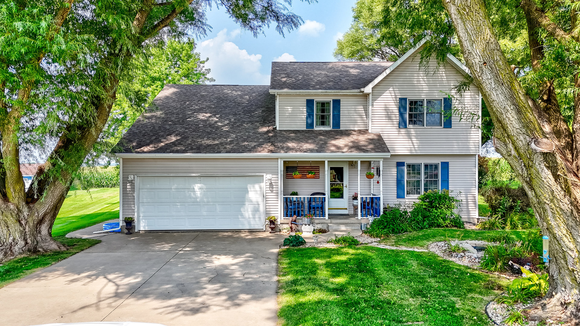 a front view of a house with garden