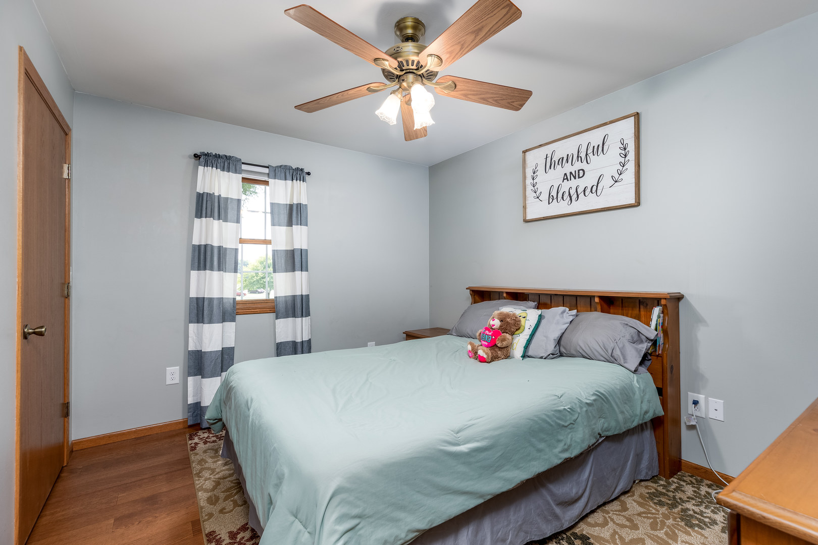 2383 North 3119th Road Marseilles, IL 61341 - Photo 13 of 19 a bedroom with bed and a chandelier