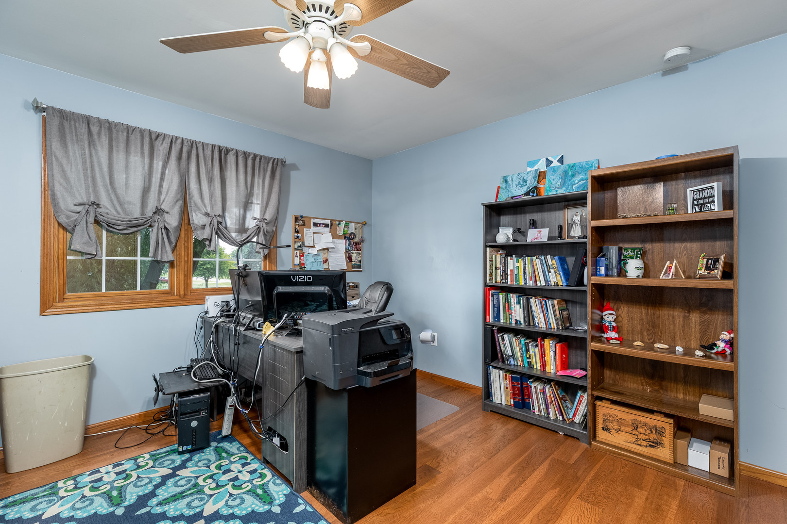 2383 North 3119th Road Marseilles, IL 61341 - Photo 14 of 19 a view of a workspace with furniture and a bookshelf