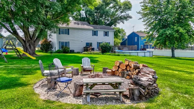 a view of a table and chairs in the garden