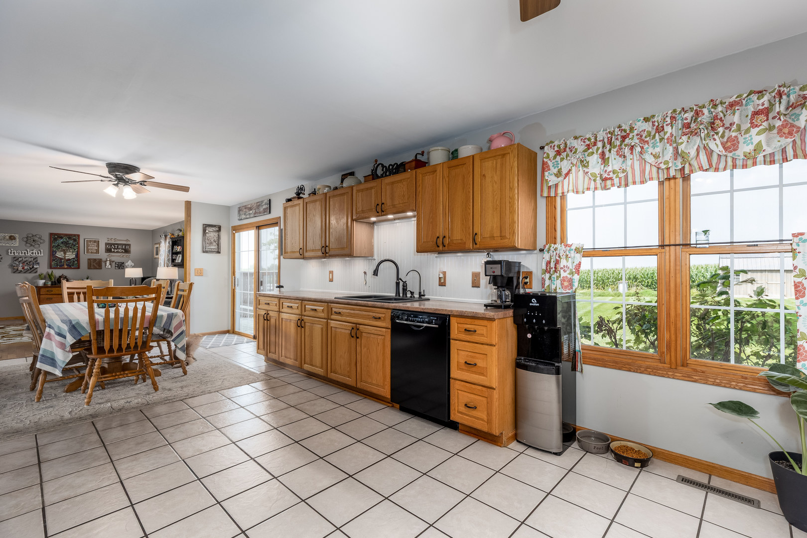2383 North 3119th Road Marseilles, IL 61341 - Photo 6 of 19 a kitchen with stainless steel appliances granite countertop a stove top oven a sink dishwasher and a refrigerator with the cabinets
