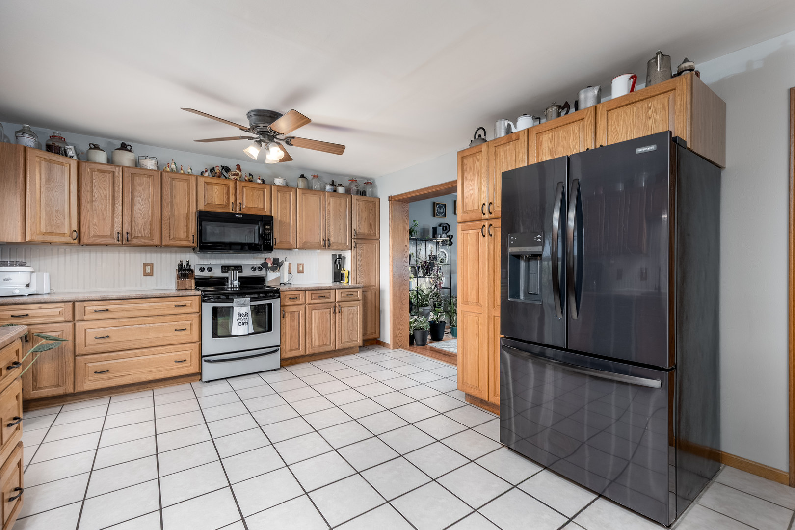 2383 North 3119th Road Marseilles, IL 61341 - Photo 7 of 19 a kitchen with granite countertop a refrigerator and a sink