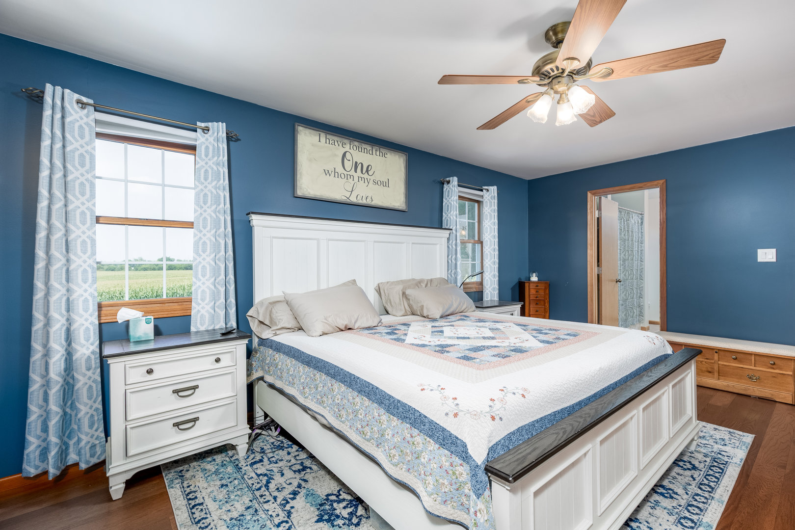2383 North 3119th Road Marseilles, IL 61341 - Photo 10 of 19 a bedroom with a bed and a chandelier