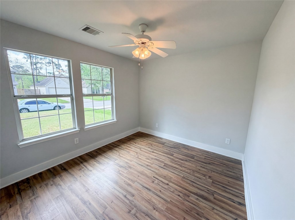 414 Binnacle Way Crosby, TX 77532 - Photo 12 of 22 wooden floor in an empty room with a window