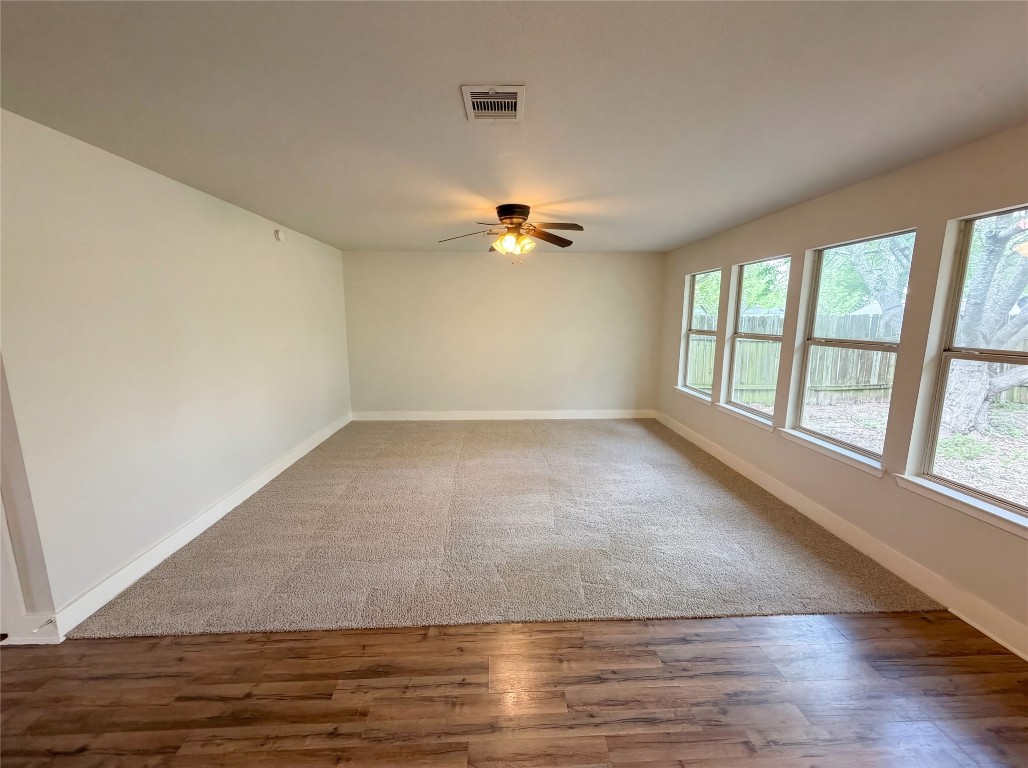 414 Binnacle Way Crosby, TX 77532 - Photo 14 of 22 wooden floor in an empty room with a window